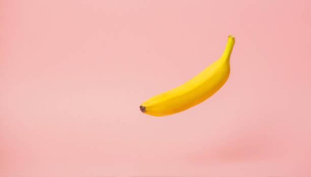 istock One yellow banana levitate in air 1025979430