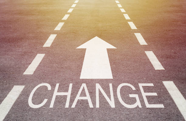 istock Change Concept, White Arrow on Road Background 1025984268