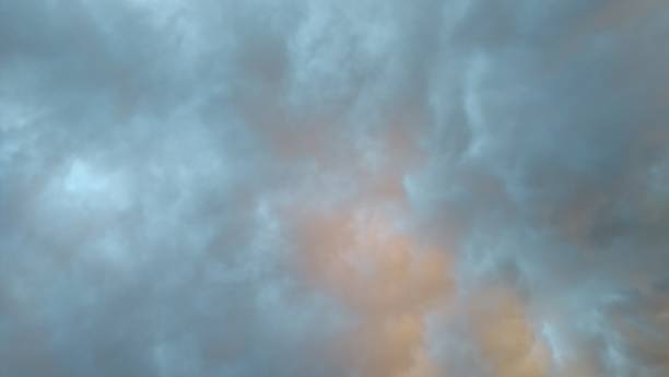 istock Superb orange pink gray blue cloudscape sunbeam 1025986804