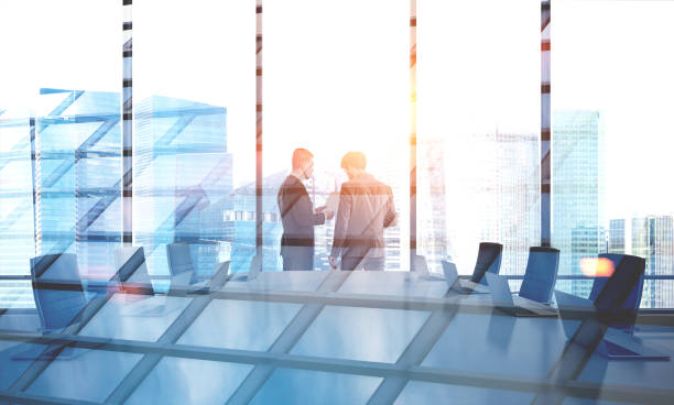 istock Businessmen in boardroom, double 1025987710