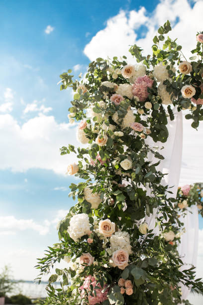istock wedding chuppa  decorated with flowers 1025993328