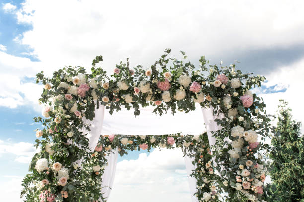 istock wedding chuppa  decorated with flowers 1025993712