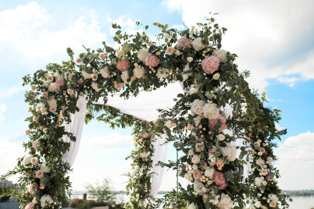 istock wedding chuppa  decorated with flowers 1025993716