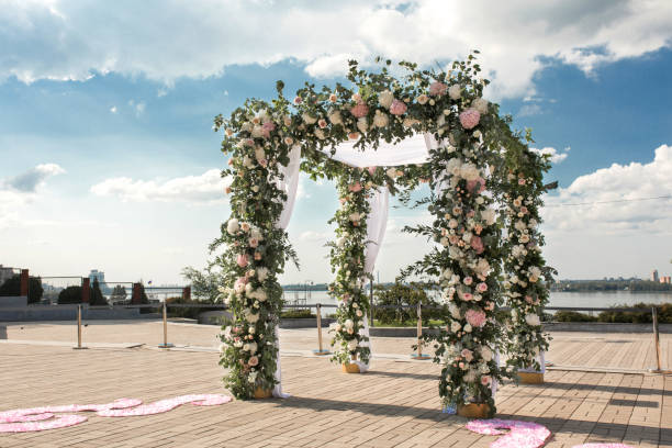 istock wedding chuppa  decorated with flowers 1025993742