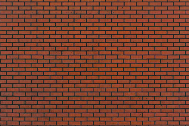 istock background, red brick with black seams 1025998360