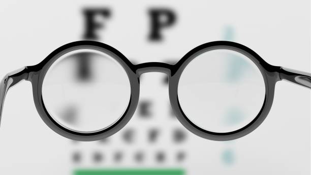 istock Pair of round-lens eyeglasses with eyesight test and blur 1025998736