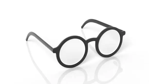 Photo of Pair of black round-lens eyeglasses, isolated on white background.