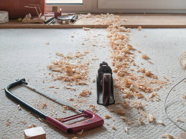 istock classic saw and jack plane made chips on bright carpet 1025999396