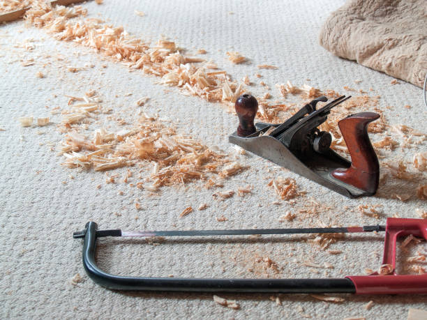 istock classic saw and jack plane made chips on bright carpet 1025999466
