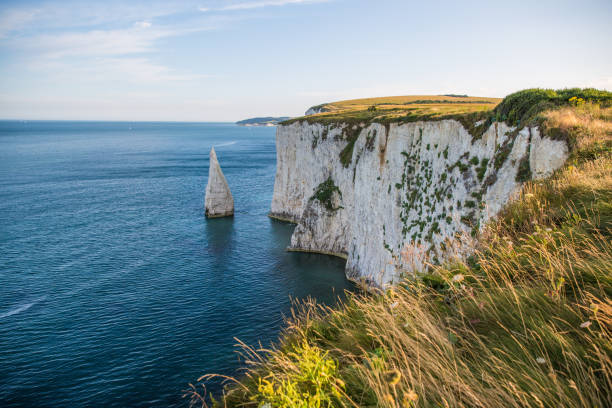 istock White Cliffs of Handfast Point with Turquoise Atlantic Ocean on a Sunny Day 1026017882