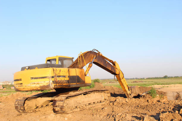 istock Yellow excavator excavating 1026018660