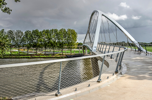 Nigtevecht, The Netherlands, August 25, 2018: the new bridge for bicycles and pedestrians across the amsterdam Rhine canal seen from the western bank