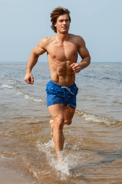 istock Man during jogging by the sea coast 1026019360