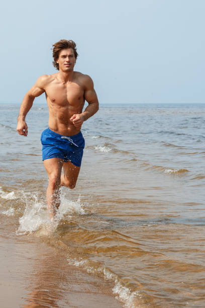 istock Man during jogging by the sea coast 1026019448