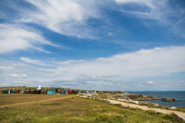 Old Lower Lighthouse and Coloured Fishing Cabins