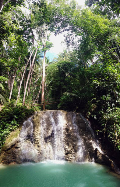 Lugnason Falls in San Juan, Siquijor Island, near Dumaguete, Negros Oriental, Philippines tropical waterfall siquijor island stock pictures, royalty-free photos & images