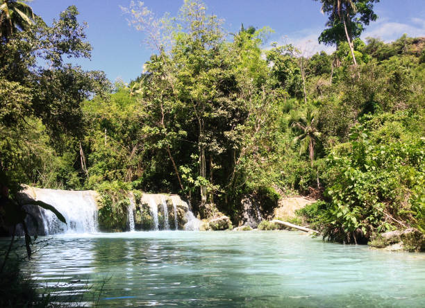 Cambugahay Falls on Siquijor Island, near Dumaguete, Negros Oriental, Philippines tropical waterfall siquijor island stock pictures, royalty-free photos & images