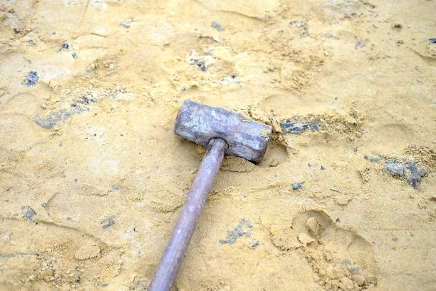 istock Steel hammer on sandy ground in construction area 1026039964