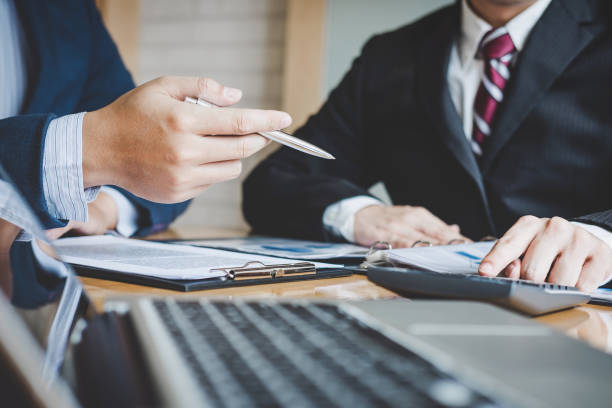 istock Teamwork process, Business team are presentation marketing plan strategy report analyzing financial at business document during meeting and discussing 1026040266