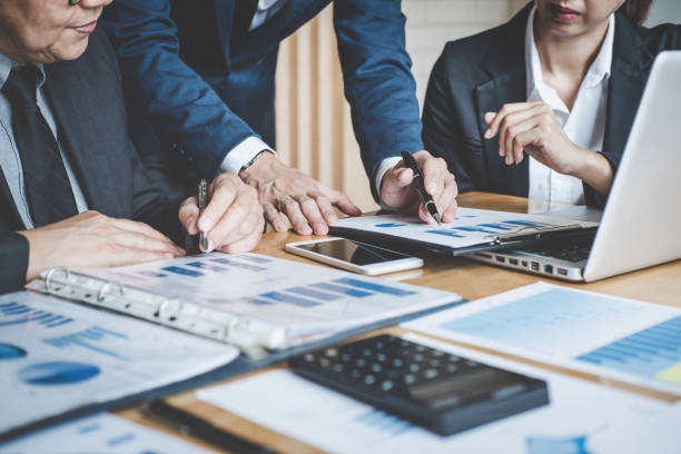 istock Executive team discussing the charts and graphs working in business strategy and financial plan to investment profit, discussing working analysis with financial data and marketing growth report 1026040664