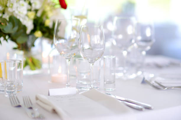 istock Beautiful table setting with crockery and flowers for a party, wedding reception or other festive event 1026051088