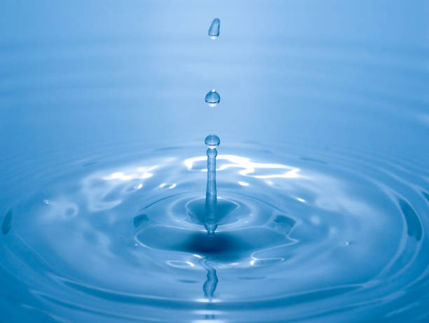 istock close up drop of water on blue background 1026051500