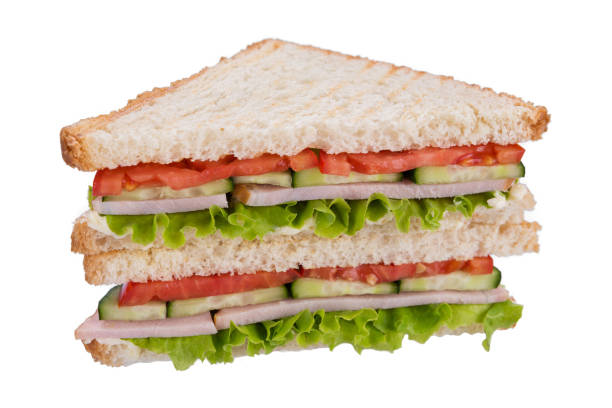istock sandwich on toasted bread with ham and cucumber, tomato and lettuce, on white background, isolate 1026051692