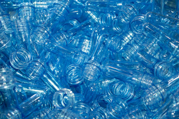 istock The preform material part for blowing plastic bottle process in the light blue scene. 1026051828