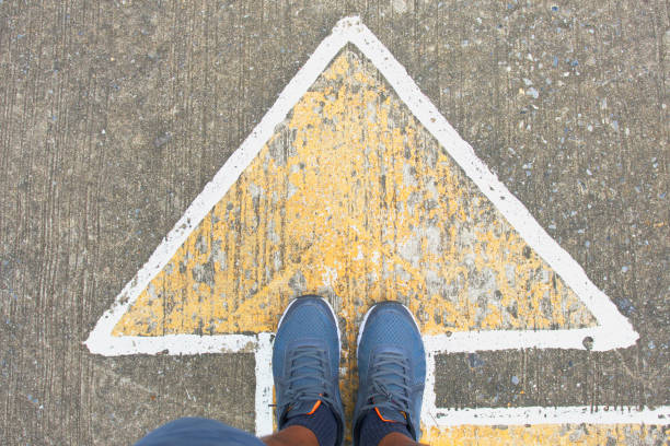 istock person standing at the crossroad 1026057712