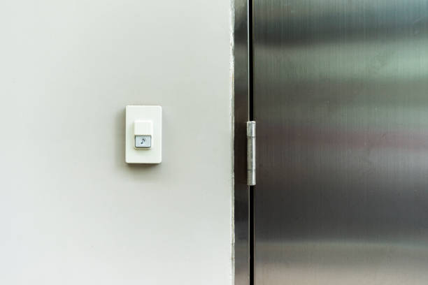 istock Closeup doorbell or buzzer on white concrete wall for called at home 1026060352