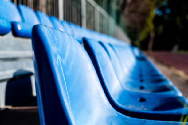 istock Empty blue stand seats on sport playground 1026066384