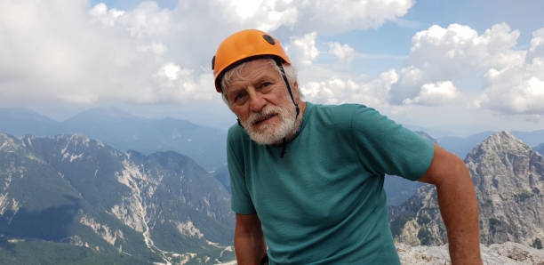 istock Senior man high up in the mountains 1026083026