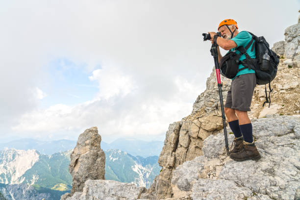 istock Senior man high up in the mountains 1026083216