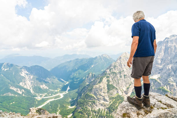 istock Senior man high up in the mountains 1026083494