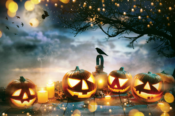 istock Spooky halloween pumpkins on wooden planks 1026097314