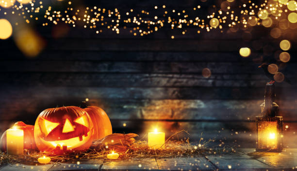 istock Spooky halloween pumpkins on wooden planks 1026097408