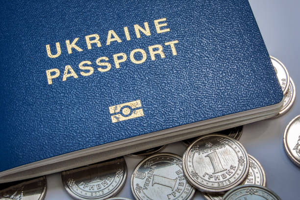 istock Ukrainian passport and new coins 1026116304