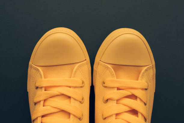 istock Stylish yellow sneakers from above 1026132634