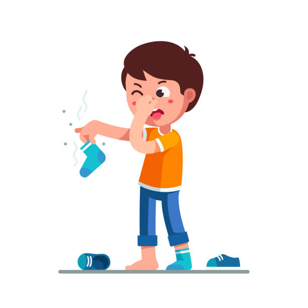 Standing boy kid holding dirty stinky sock in hand closing nose and taking out tongue in disgust face expression. Childhood hygiene flat vector clipart illustration. Standing boy kid holding dirty smelling sock in hand closing nose and taking out tongue in yuck face expression. Child smelly sock. Cartoon character feeling bad stinky smell. Flat vector illustration isolated on white background. kids dirty shoes stock illustrations
