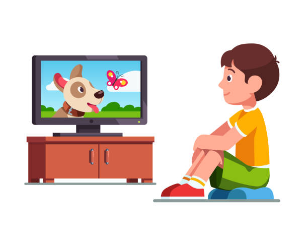 Smiling preschool boy kid sitting and dreaming of own dog watching film on TV about dog and butterfly. Child cartoon character flat vector clipart illustration. Smiling preschool boy kid sitting on cushion and watching film on TV about dog and butterfly. Kid dreaming about own dog watching TV. Child leisure. Flat style vector illustration isolated on white background. kids watching tv stock illustrations