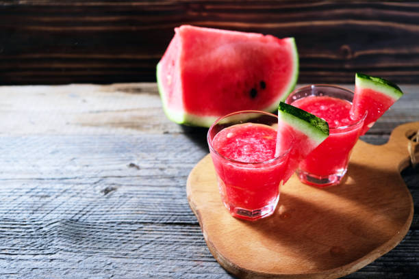 istock Watermelon smoothie in glass on wood table. summer refreshment 1026136230