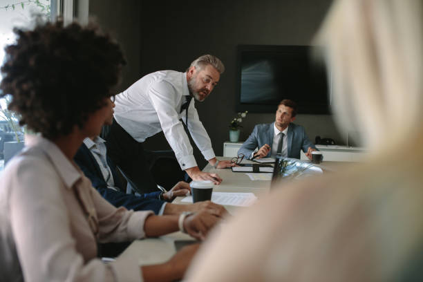 istock Senior executive explaining something to his team in a meeting 1026149140