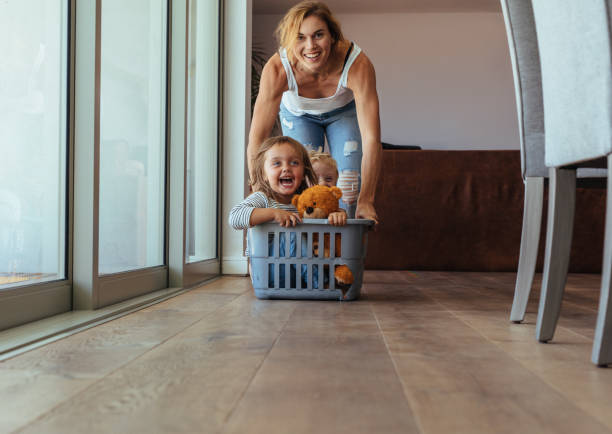 istock Children enjoying at home with mother 1026154680