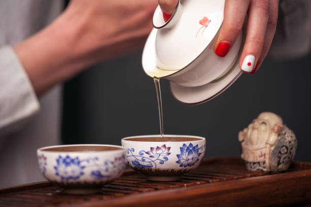 istock Woman brewing tea in traditional chinese teaware. 1026164152