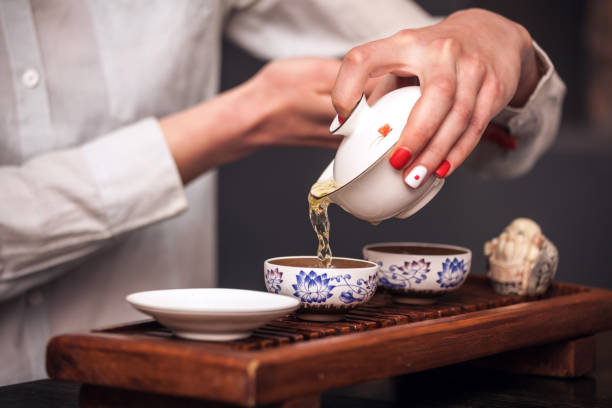 istock Woman brewing tea in traditional chinese teaware. 1026164310