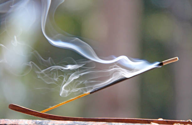 istock Incense stick and smoke from incense burning. Beautiful smoke. Blurred background and design with copy space 1026164480