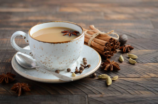 istock Indian masala chai tea. Spiced tea with milk on the rustic wooden table. 1026165272