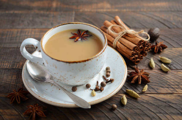 istock Indian masala chai tea. Spiced tea with milk on the rustic wooden table. 1026165276