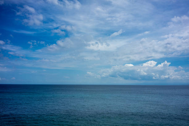 istock ocean water with blue sky and clouds, full frame 1026178480