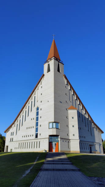 istock Modern church against blue sky. Bottom view. Naujoji Akmene, Lithuania 1026178582
